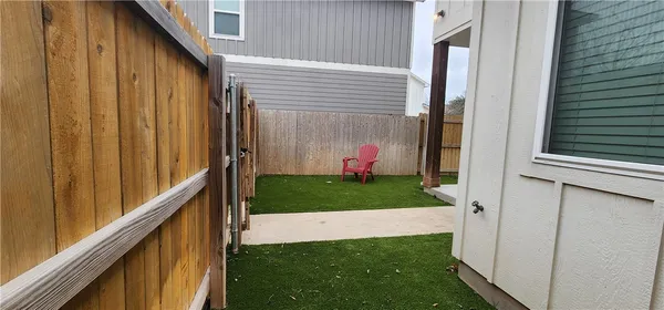 a view of a backyard with a garden and plants