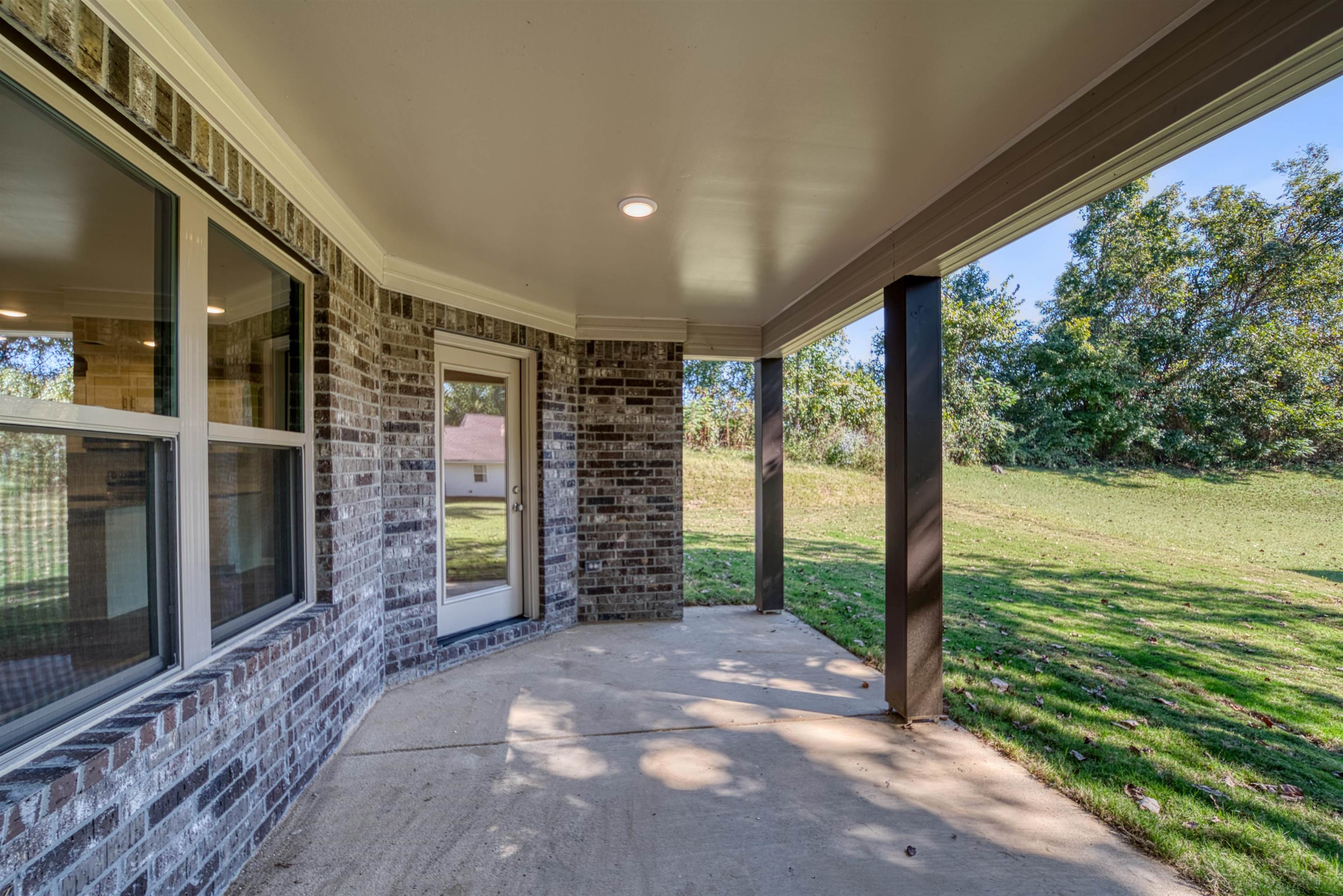109 Walnut Ridge Ripley, TN 38063 - Photo 30 of 39 a view of an empty room with floor to ceiling window and an outdoor view