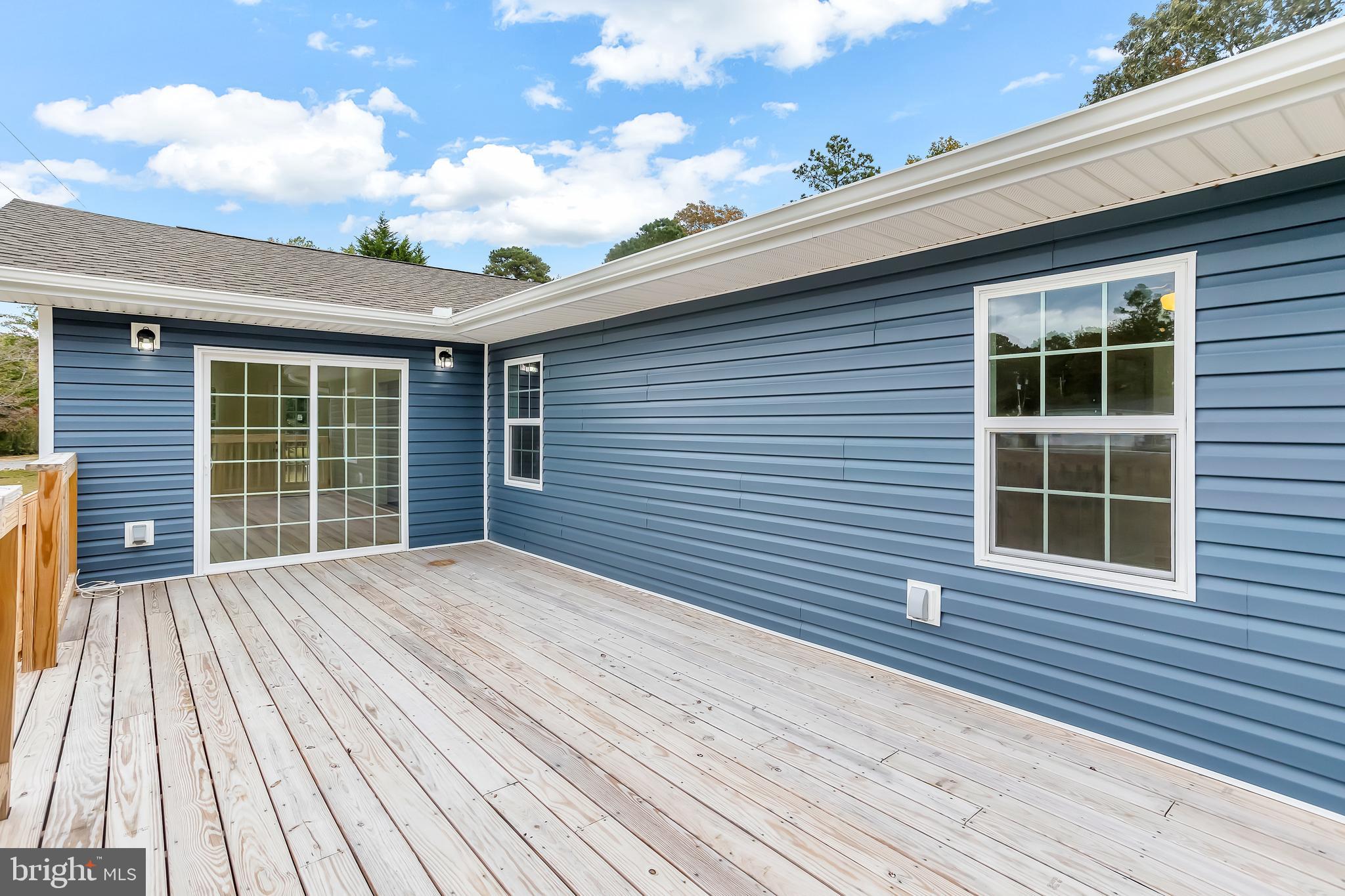 26519 Siloam Road Salisbury, MD 21801 - Photo 42 of 69 a view of a house with a deck