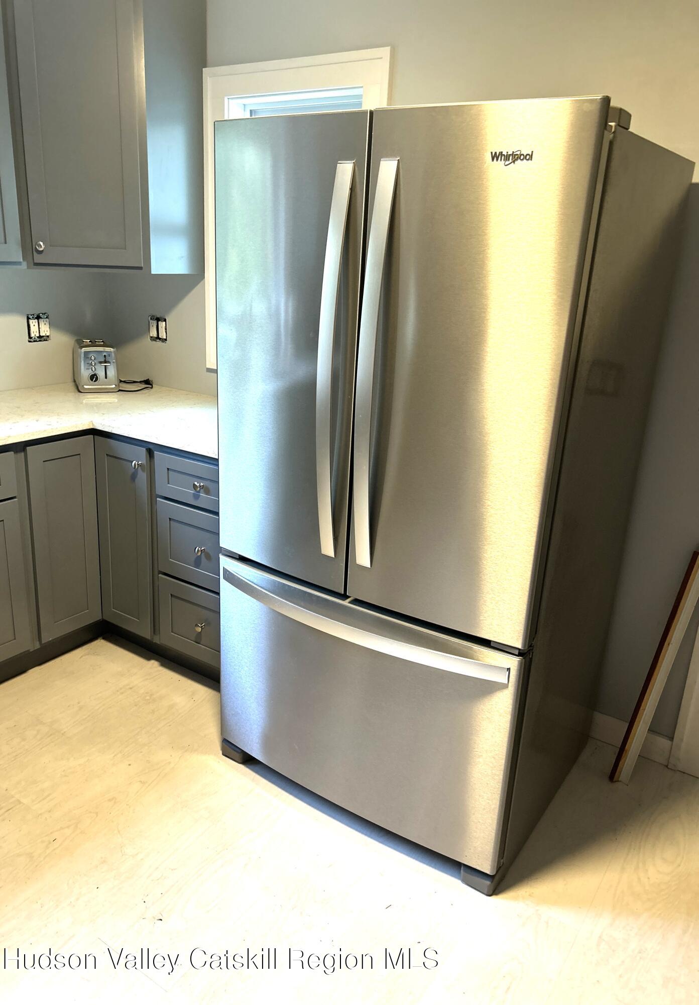 169 Rt 4 Prattsville, NY 12468 - Photo 19 of 43 a kitchen with stainless steel appliances a refrigerator and a sink