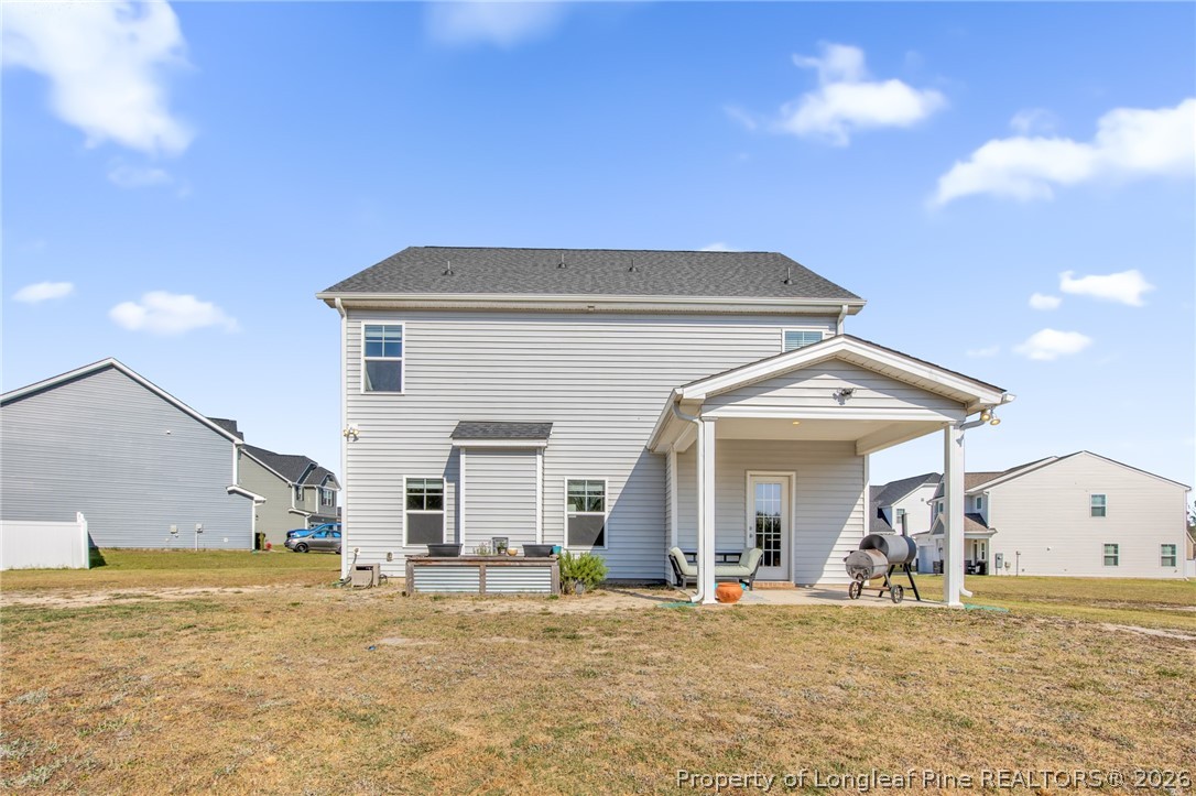 44 Princelet Point Cameron, NC 28326 - Photo 2 of 42 a view of a house with a patio and a yard