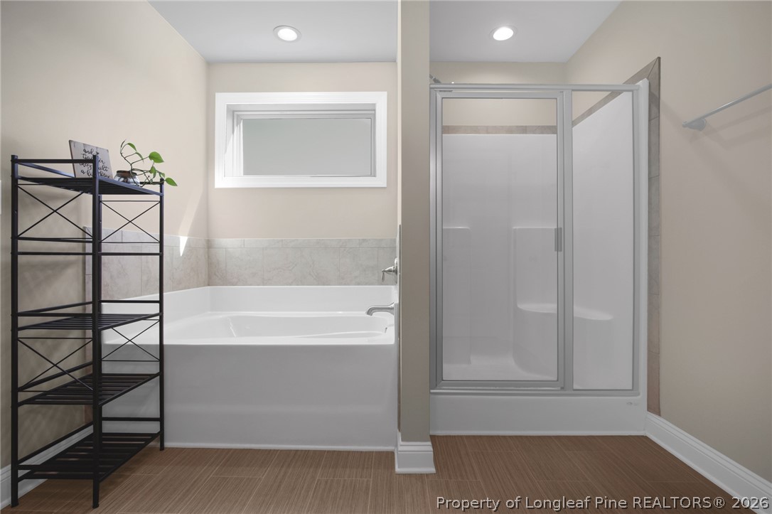 44 Princelet Point Cameron, NC 28326 - Photo 25 of 42 a bathroom with a bathtub and a shower