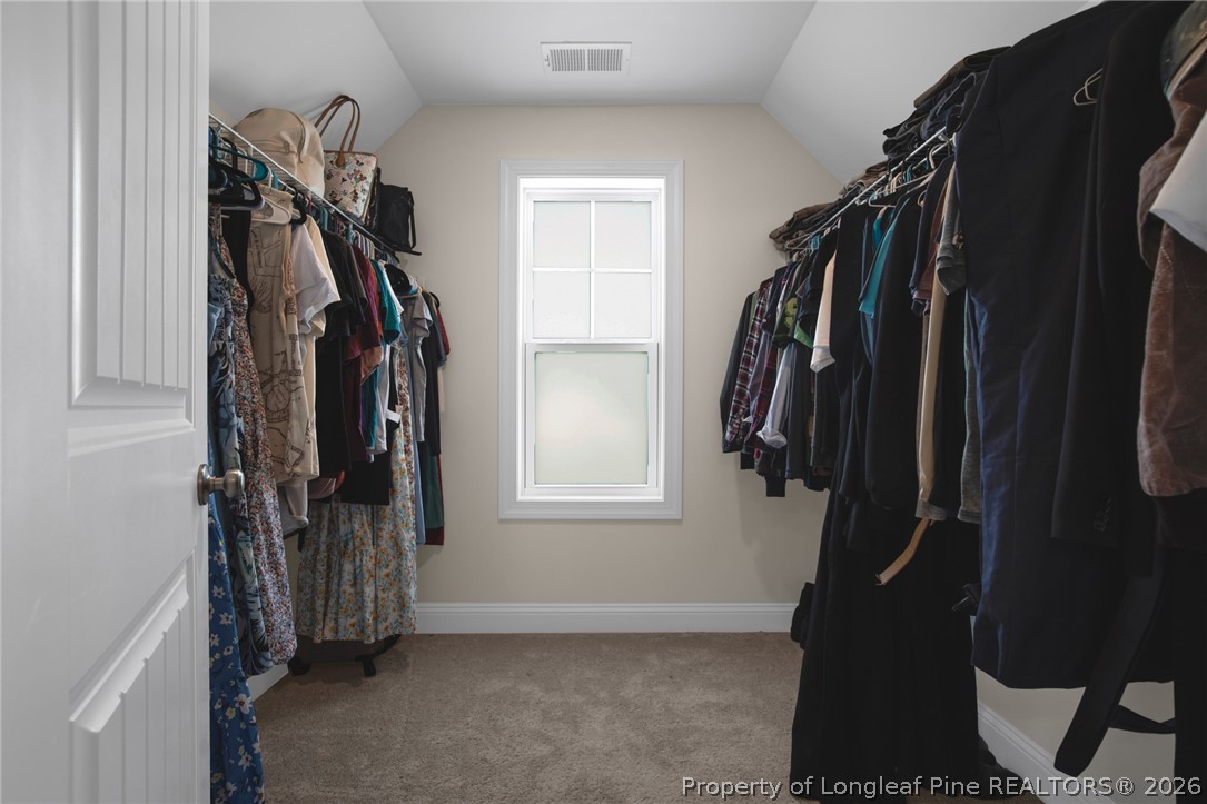 44 Princelet Point Cameron, NC 28326 - Photo 26 of 42 a view of walk in closet with clothes