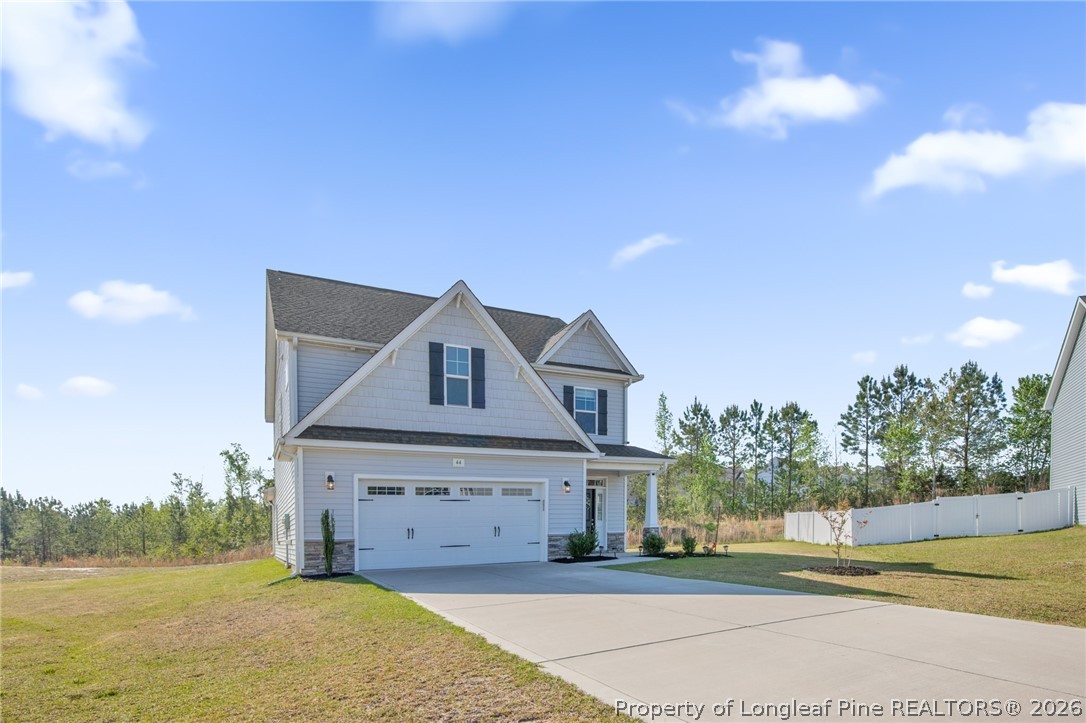 44 Princelet Point Cameron, NC 28326 - Photo 37 of 42 a front view of a house with a yard