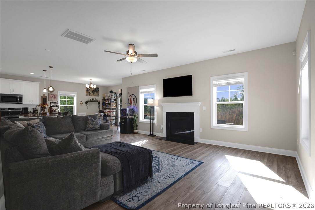 44 Princelet Point Cameron, NC 28326 - Photo 8 of 42 a living room with furniture a fireplace and a flat screen tv