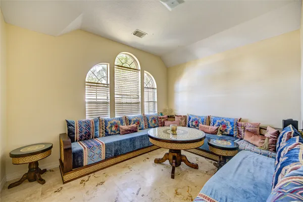 a living room with furniture and a large window