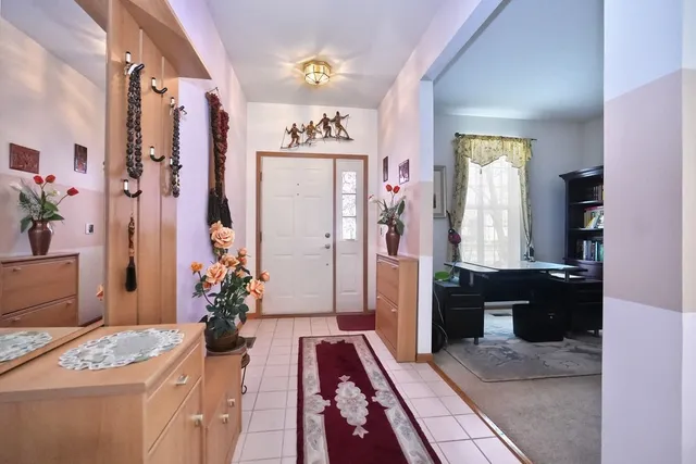 a view of an entryway and kitchen