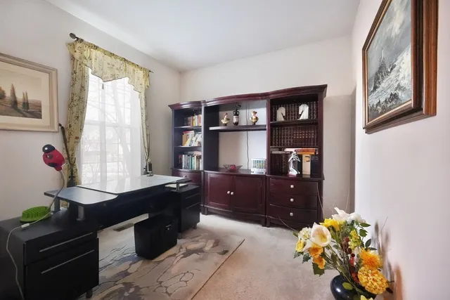 a living room with furniture flowerpot and window