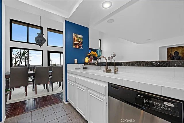 a kitchen with a sink cabinets and window
