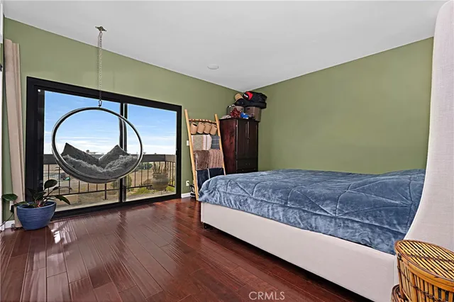 a bedroom with a bed and a mirror