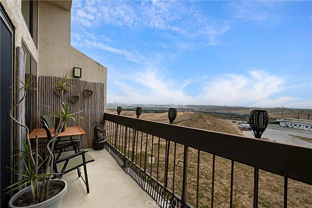 a view of balcony with furniture