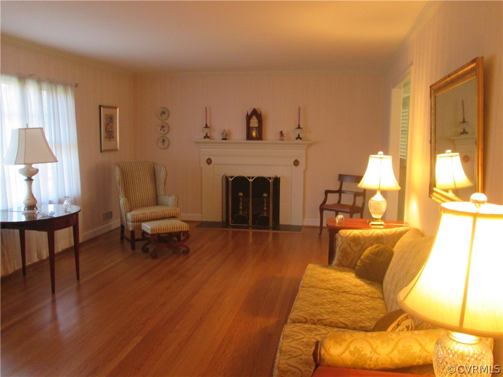 8222 Overbury Road Richmond, VA 23227 - Photo 4 of 16 Bright living room with large window, brick FP, an