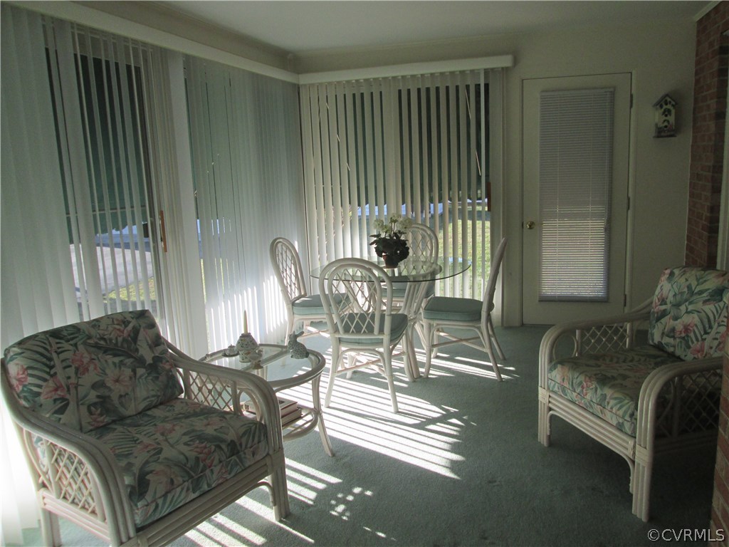 8222 Overbury Road Richmond, VA 23227 - Photo 7 of 16 Bright sunroom with verticle blinds and wall to wa