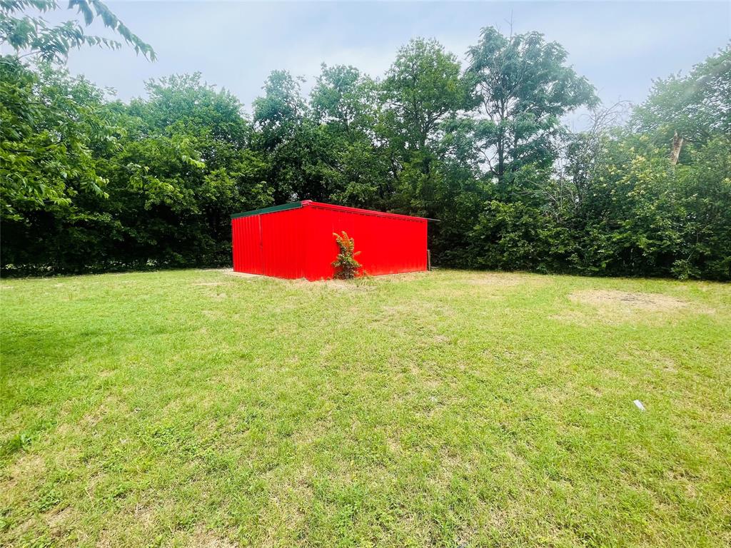 111 Rousseau Street Waxahachie, TX 75165 - Photo 15 of 22 a view of pool and red house