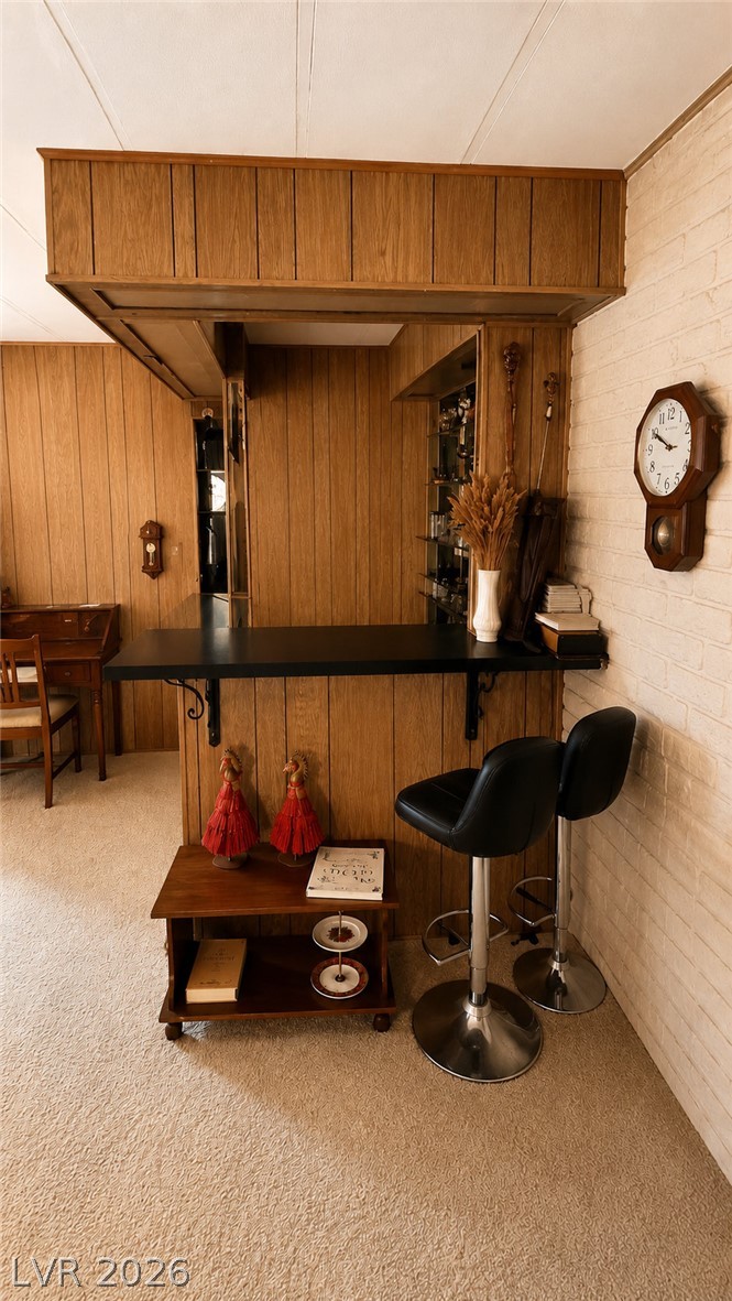 2764 Rainer Court Las Vegas, NV 89142 - Photo 3 of 13 Enjoy this in-home bar for entertainment and fun, complete with classic wood paneling, a sink area and a comfortable serving area.