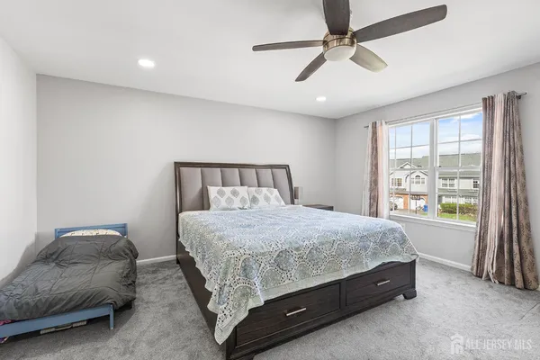 a view of a workspace with furniture and a gate