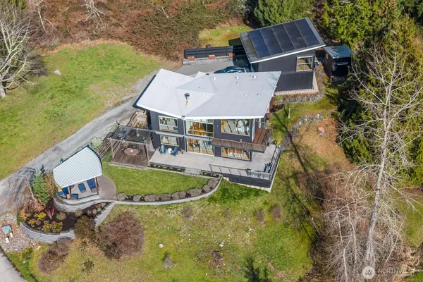 a balcony with table and chairs