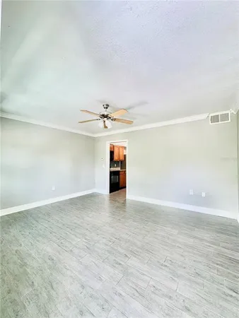 a view of an empty room with a window