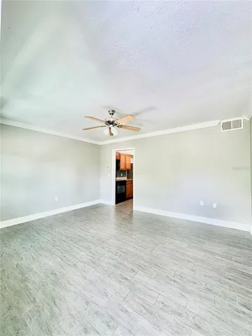 a view of an empty room with a window