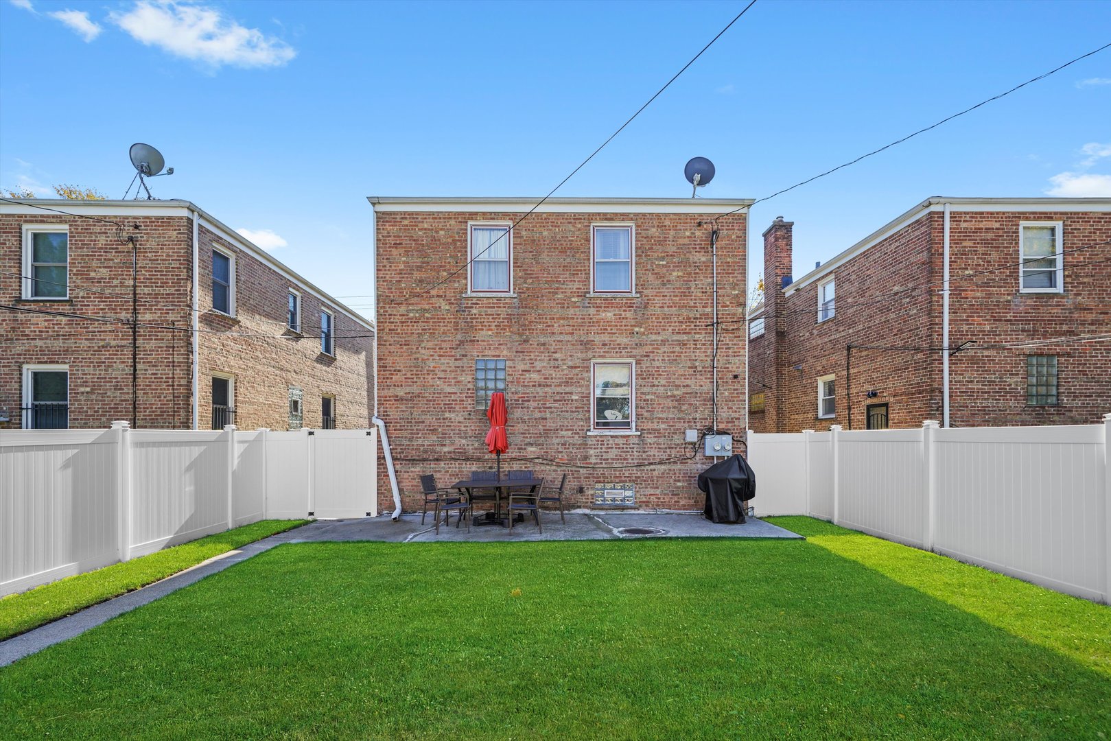3401 Jackson Street Bellwood, IL 60104 - Photo 16 of 26 a front view of a house with a yard