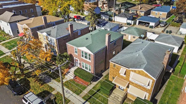 an aerial view of residential houses with outdoor space