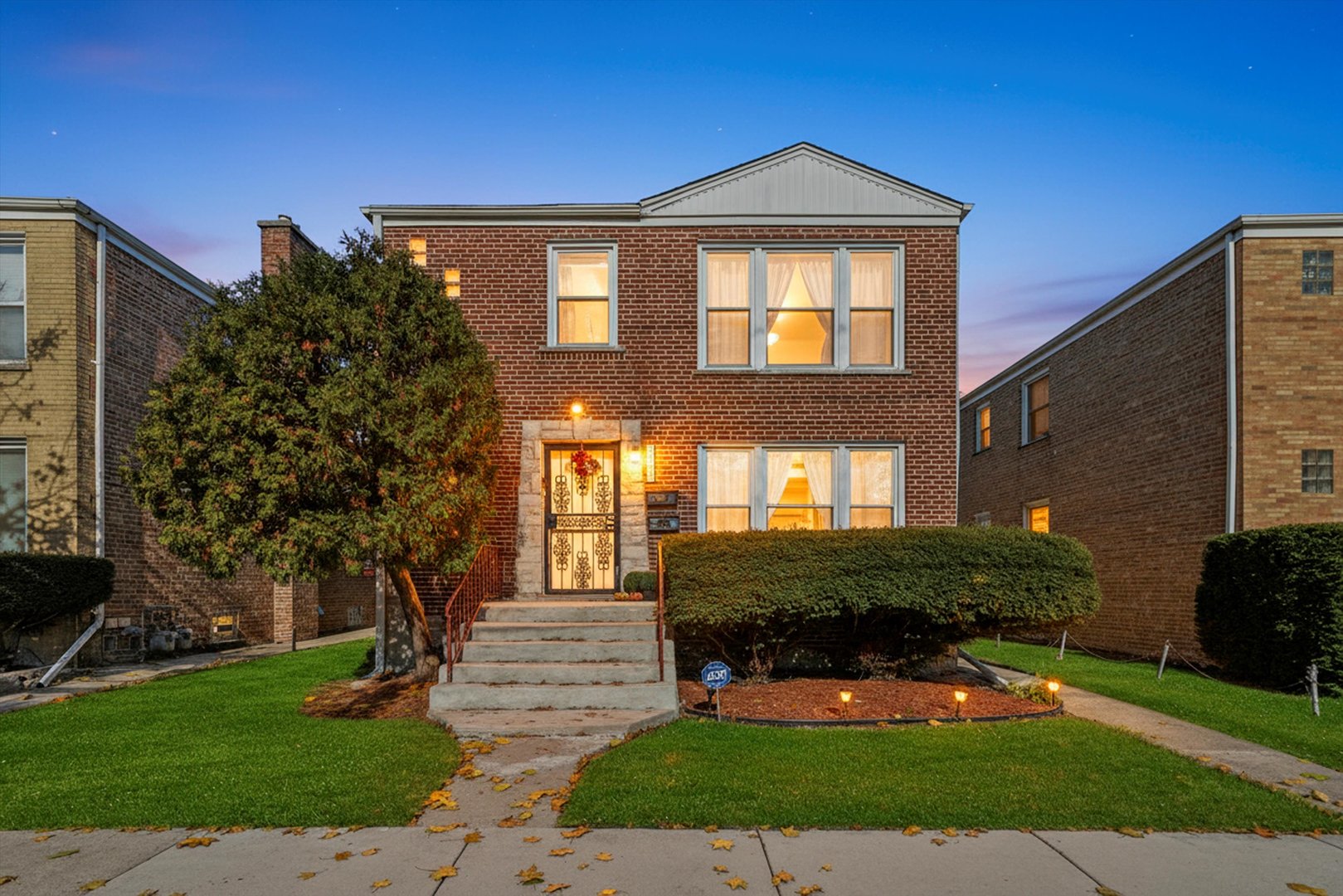 3401 Jackson Street Bellwood, IL 60104 - Photo 25 of 26 a front view of a house with a yard