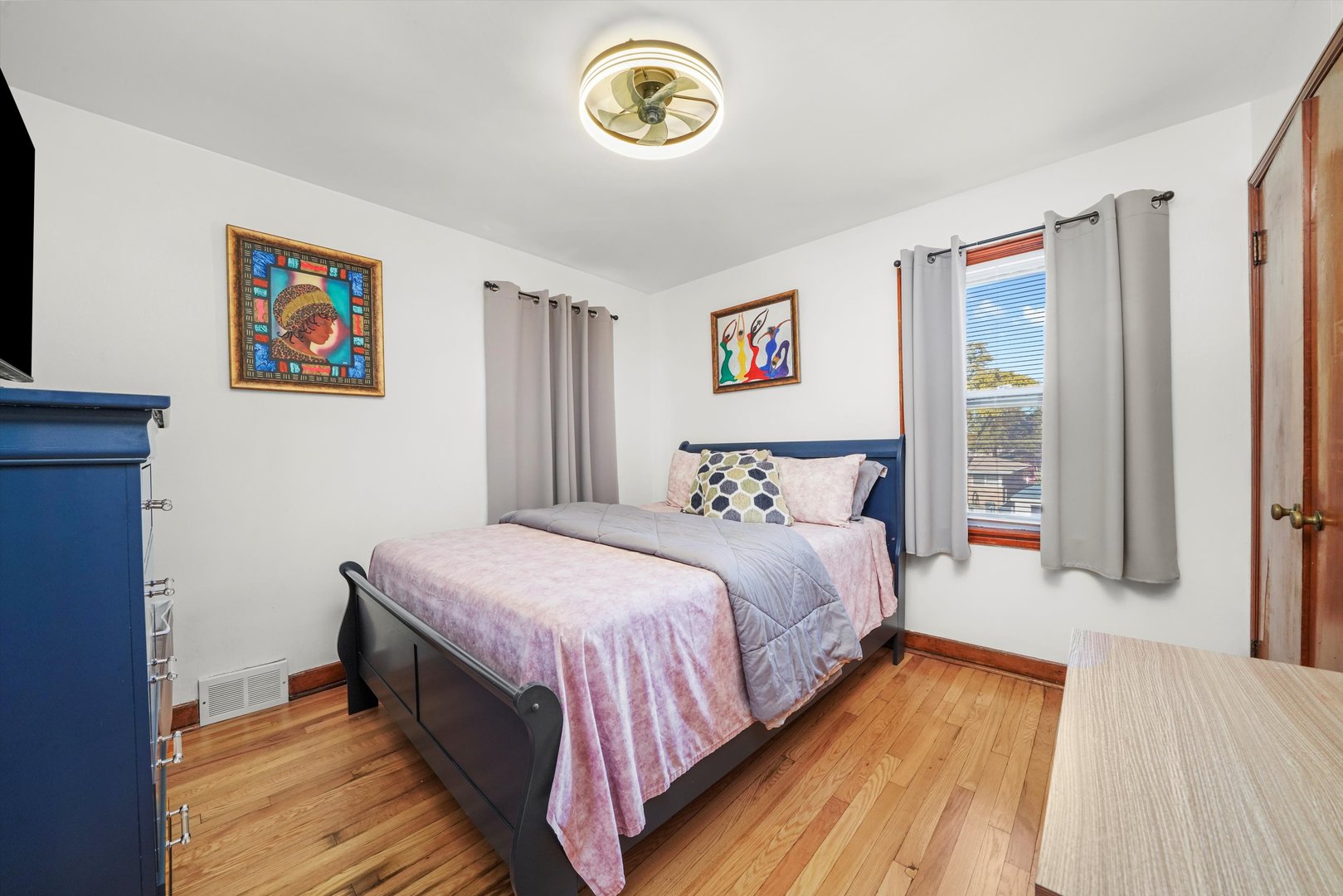 3401 Jackson Street Bellwood, IL 60104 - Photo 7 of 26 a bedroom with a bed and a window