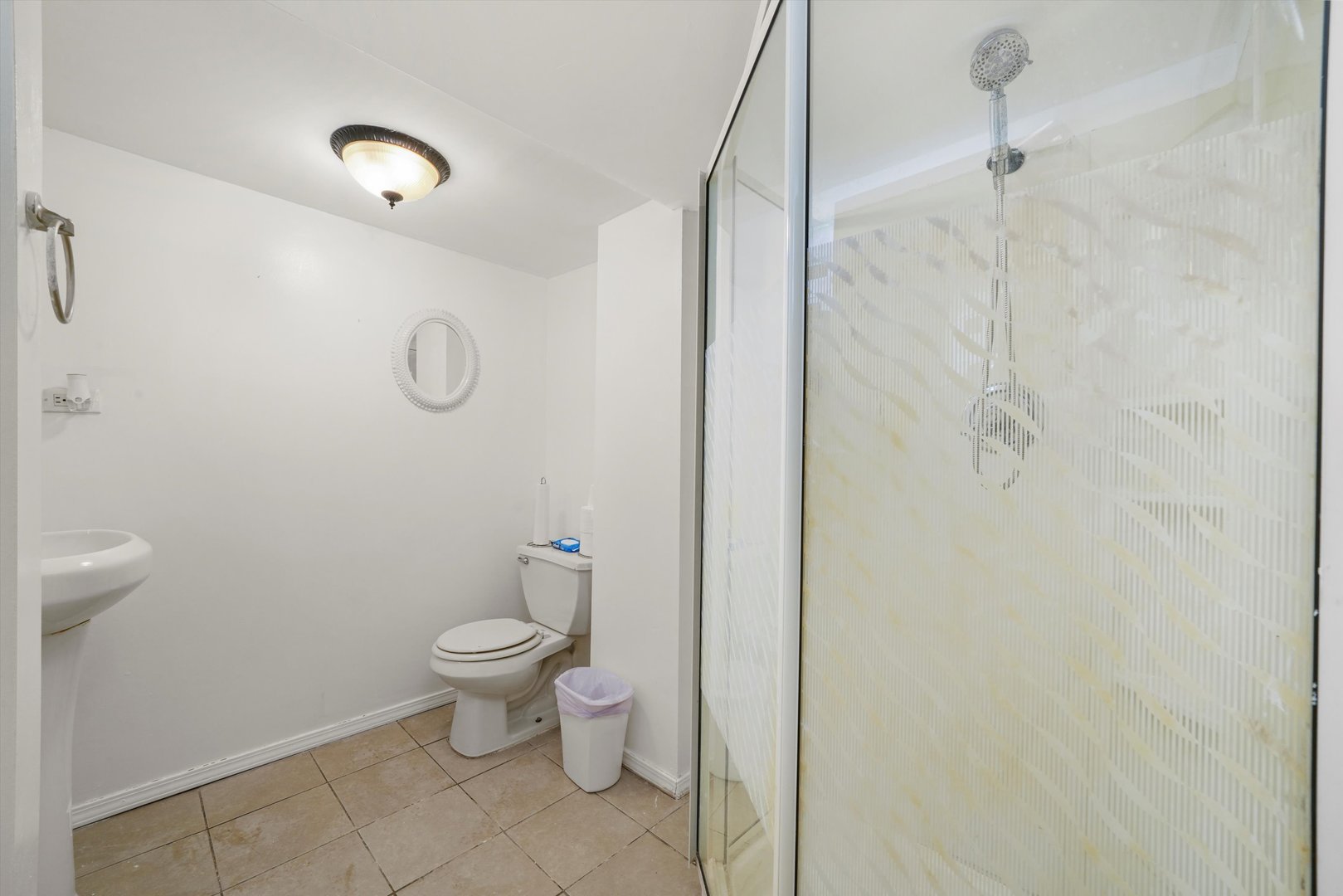 3401 Jackson Street Bellwood, IL 60104 - Photo 10 of 26 a bathroom with a toilet and a shower