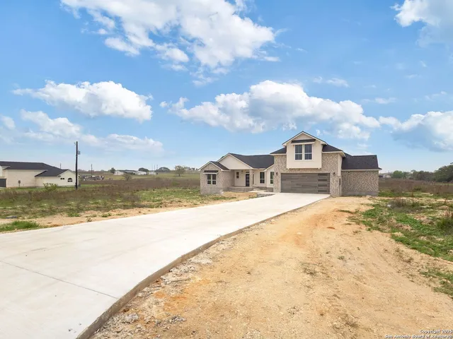 a front view of a house with yard