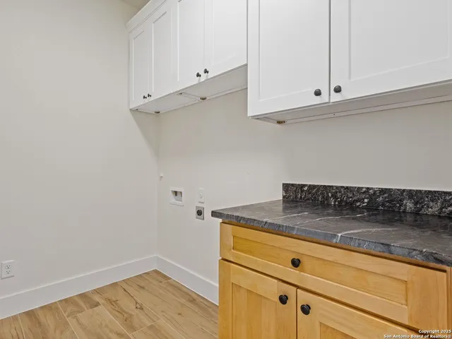 a bedroom with a bed window and a flat screen tv