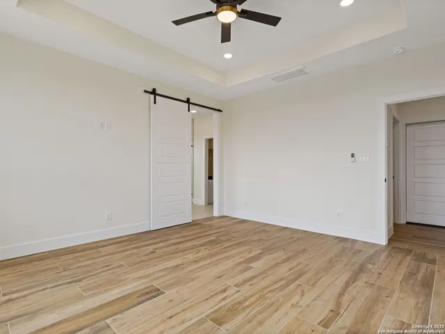 a white bath tub sitting next to a window