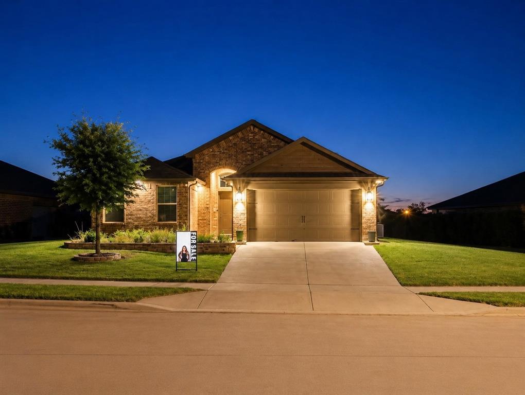 4600 Fringetree Way Crowley, TX 76036 - Photo 1 of 40 Brick facade residential exterior featuring a two-car garage, concrete driveway, and front lawn with mature landscaping