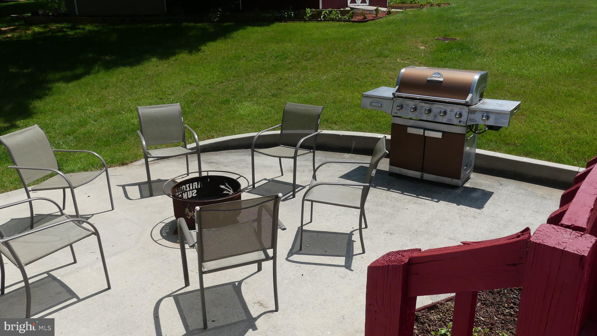 212 Ridley Drive York, PA 17402 - Photo 20 of 68 a table and chairs sitting in the grass