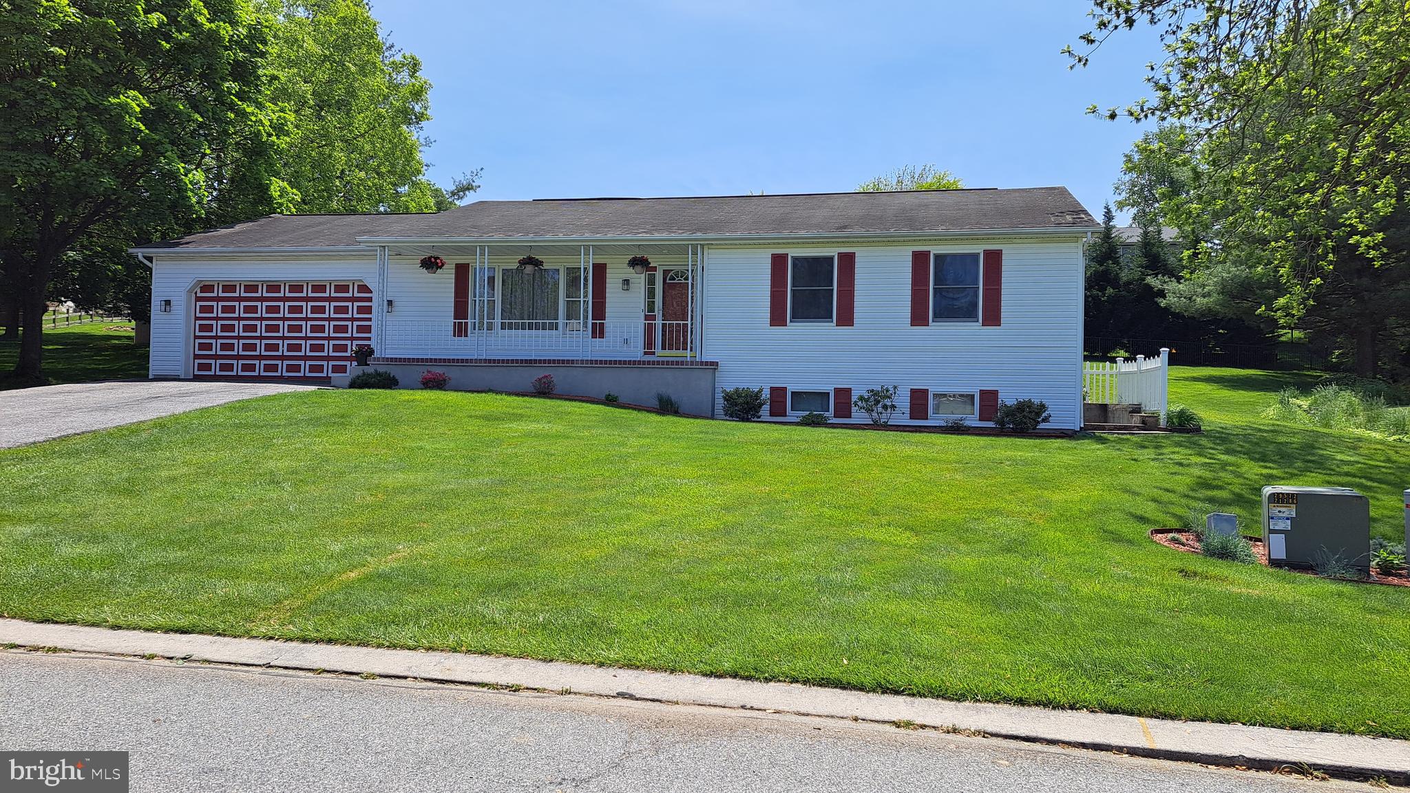 212 Ridley Drive York, PA 17402 - Photo 2 of 68 a front view of a house with a garden and yard