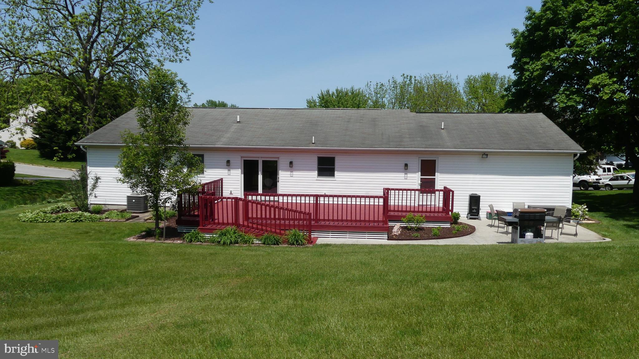 212 Ridley Drive York, PA 17402 - Photo 25 of 68 a front view of house with yard and green space