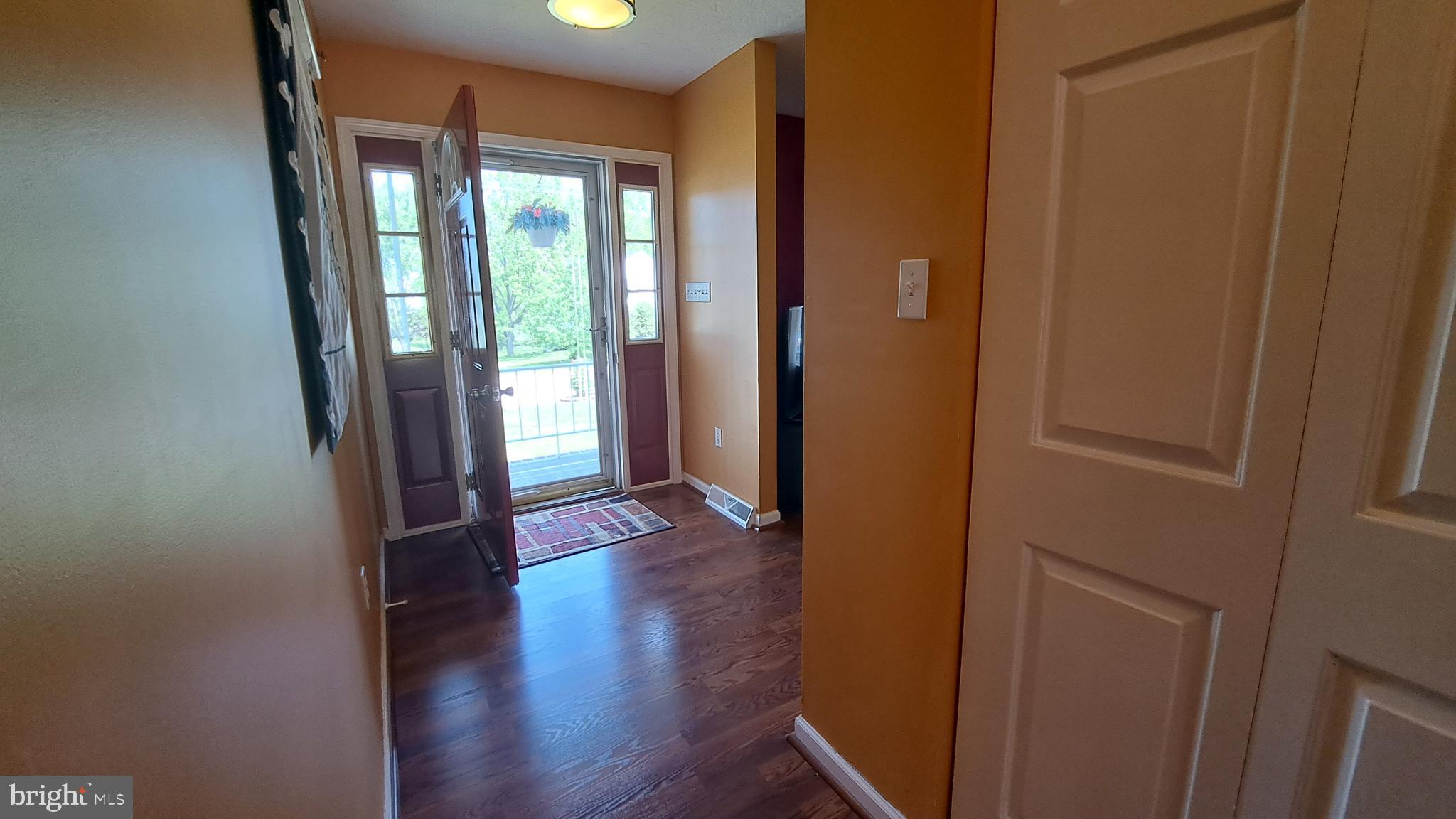 212 Ridley Drive York, PA 17402 - Photo 29 of 68 a view of an empty room with wooden floor and a window