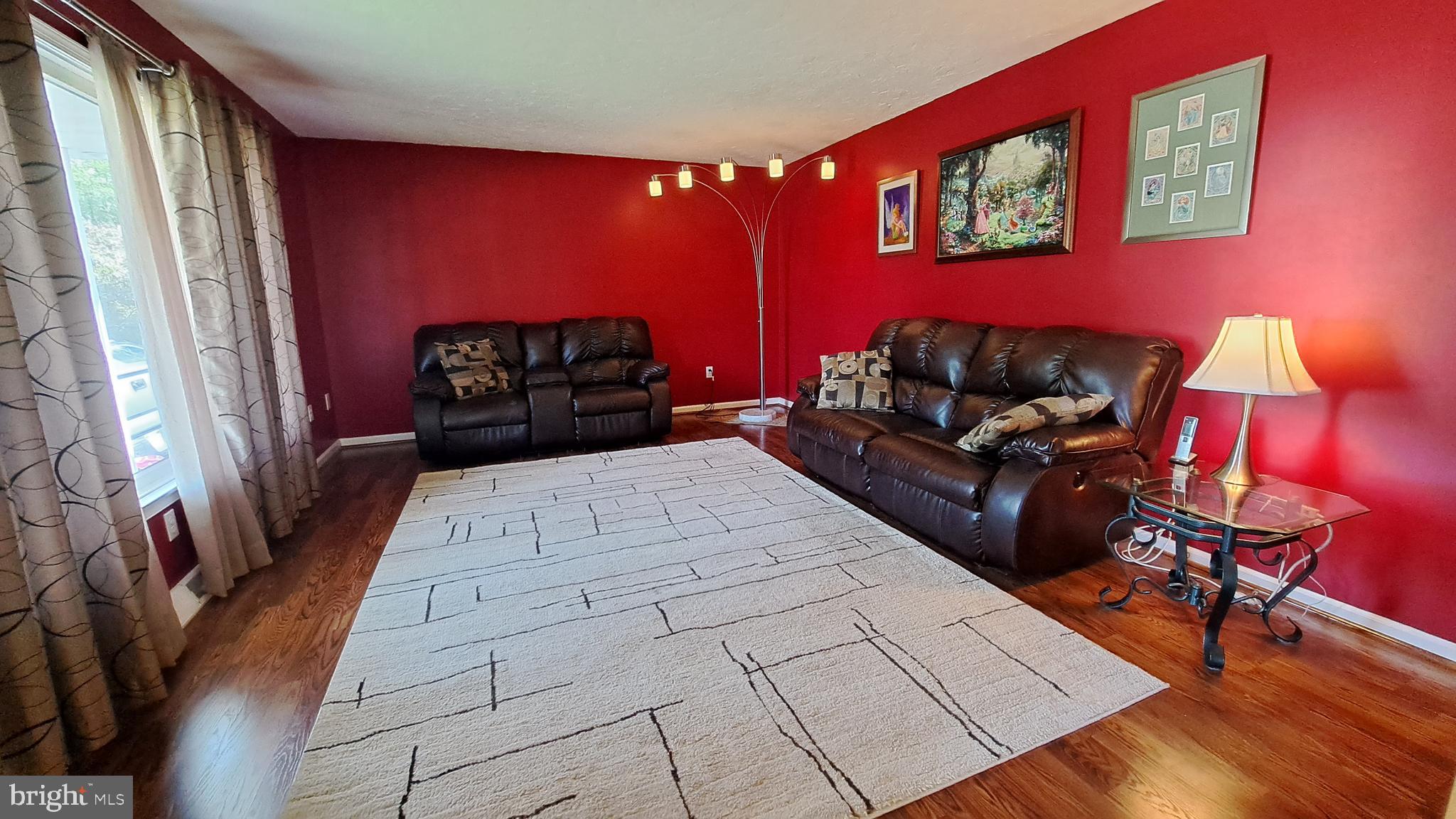 212 Ridley Drive York, PA 17402 - Photo 31 of 68 a living room with furniture a rug and a large mirror