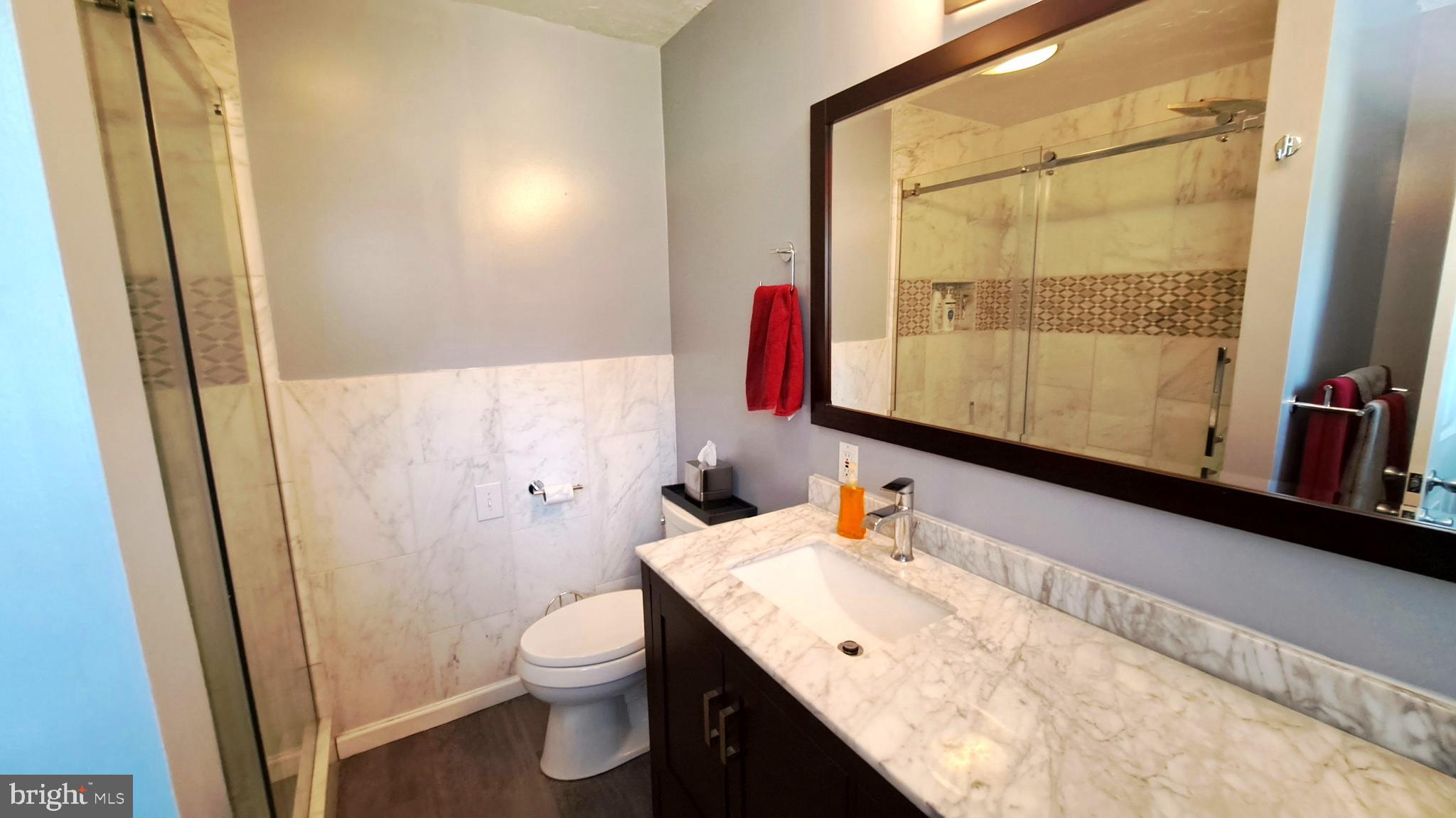 212 Ridley Drive York, PA 17402 - Photo 45 of 68 a bathroom with a granite countertop sink toilet and a mirror
