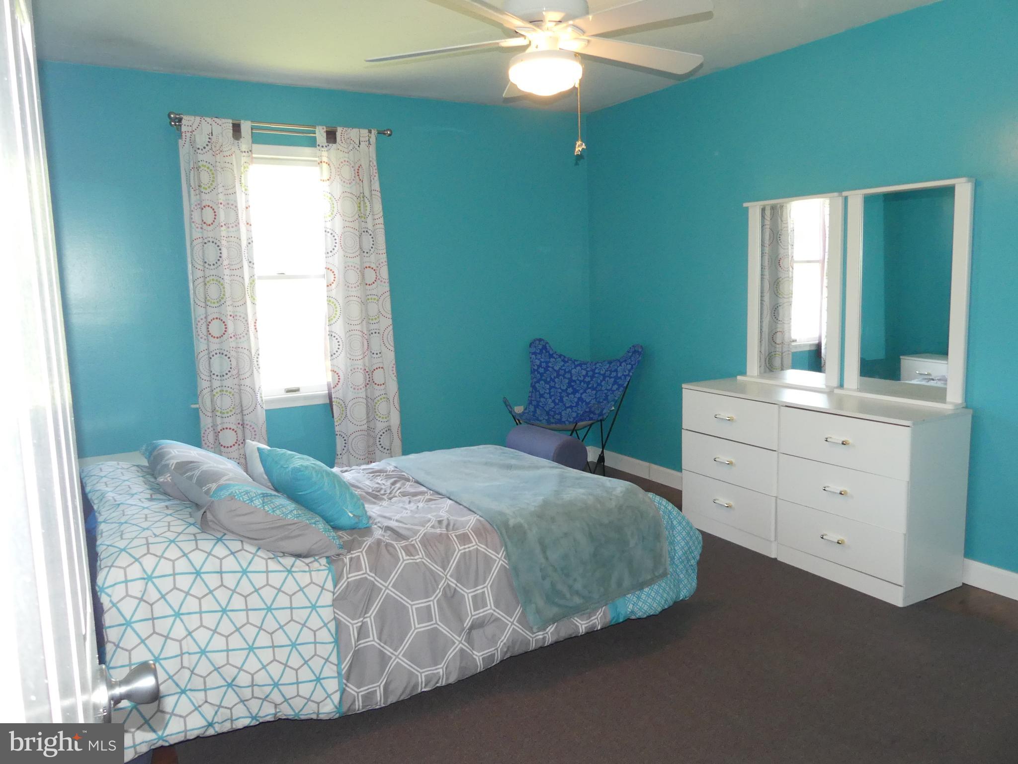 212 Ridley Drive York, PA 17402 - Photo 53 of 68 a bedroom with a bed and a dresser