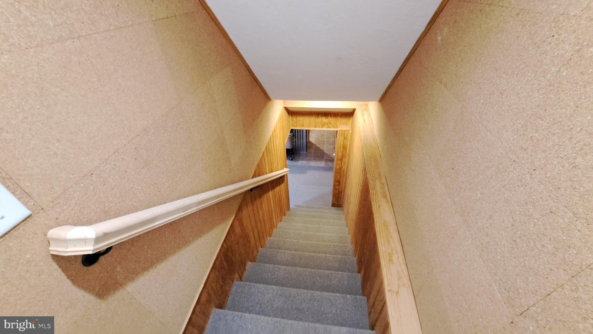 212 Ridley Drive York, PA 17402 - Photo 55 of 68 a view of a hallway with wooden floor and stairs