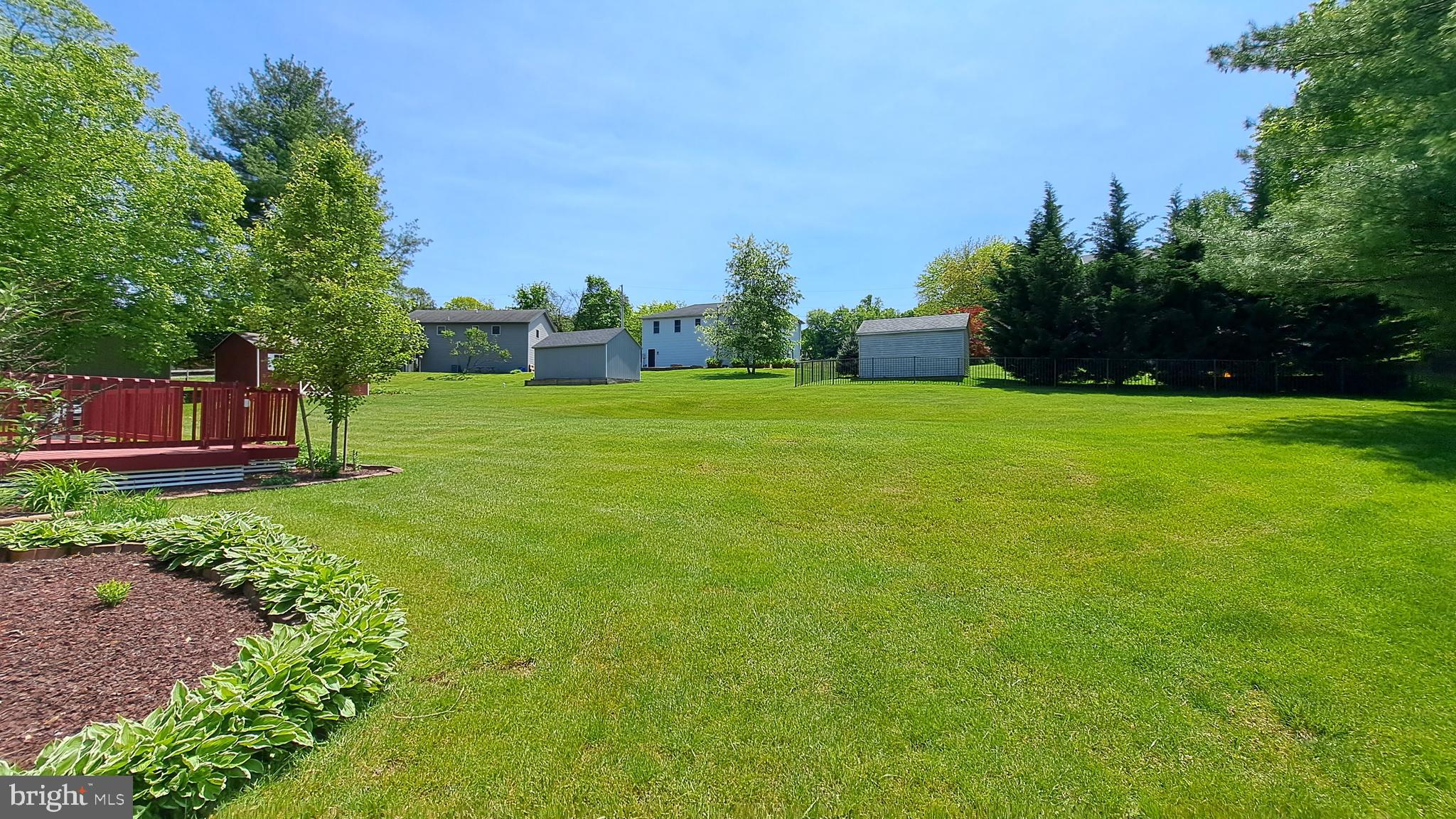 212 Ridley Drive York, PA 17402 - Photo 7 of 68 a view of a big yard with plants and a large tree
