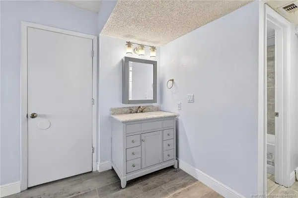 a bathroom with a double vanity sink and mirror