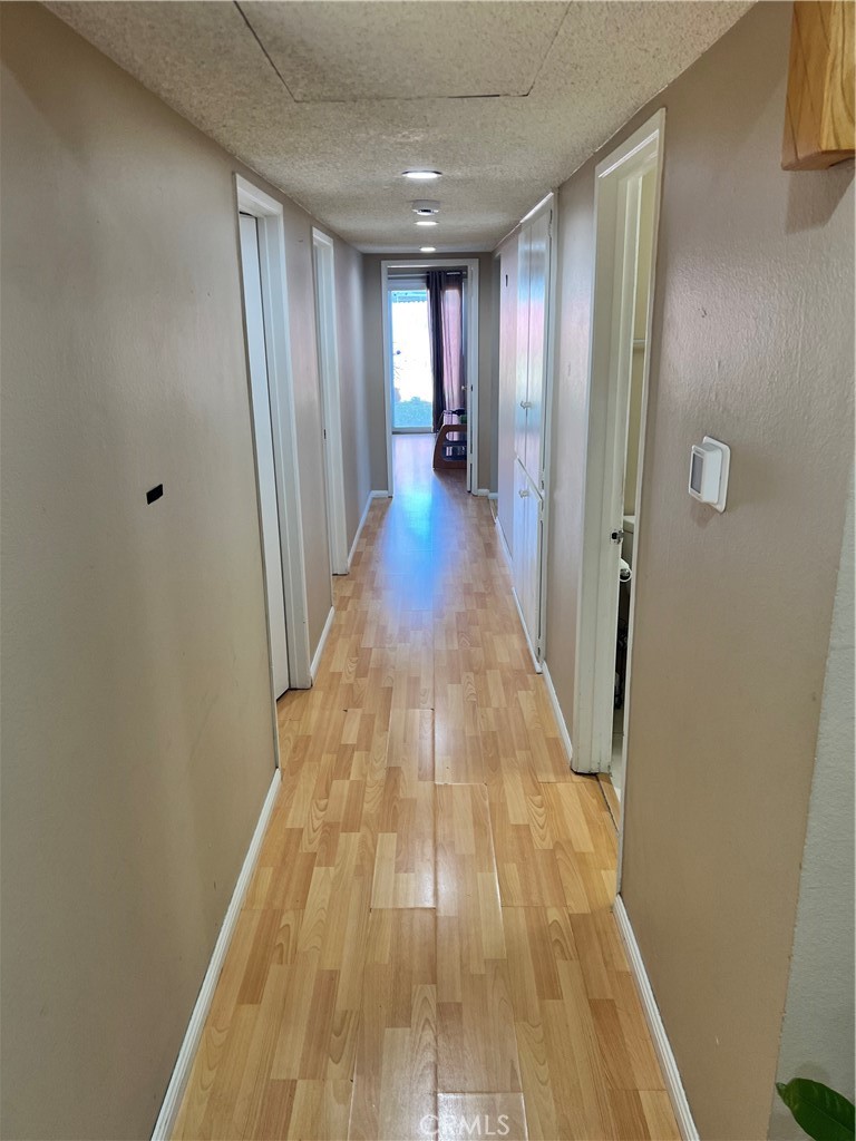 20002 Tajauta Avenue Carson, CA 90746 - Photo 12 of 32 Hallway, 3 rooms to the left, 1 at the end, bathroom and closet to the right