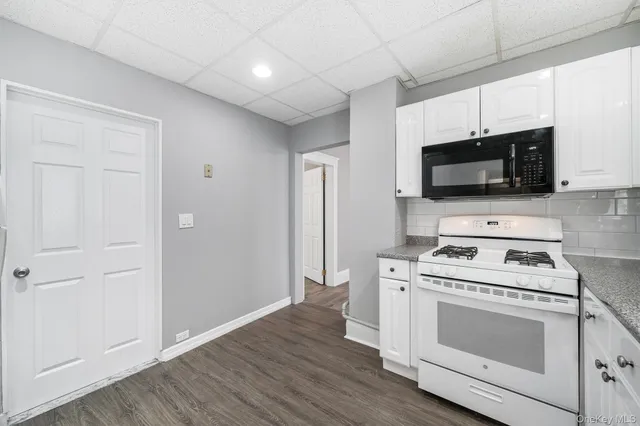 a kitchen with a stove and a microwave