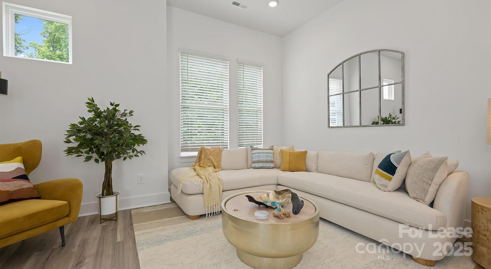 5150 Old Ridge Road, Unit B2 Charlotte, NC 28269 - Photo 12 of 27 a living room with furniture and a potted plant