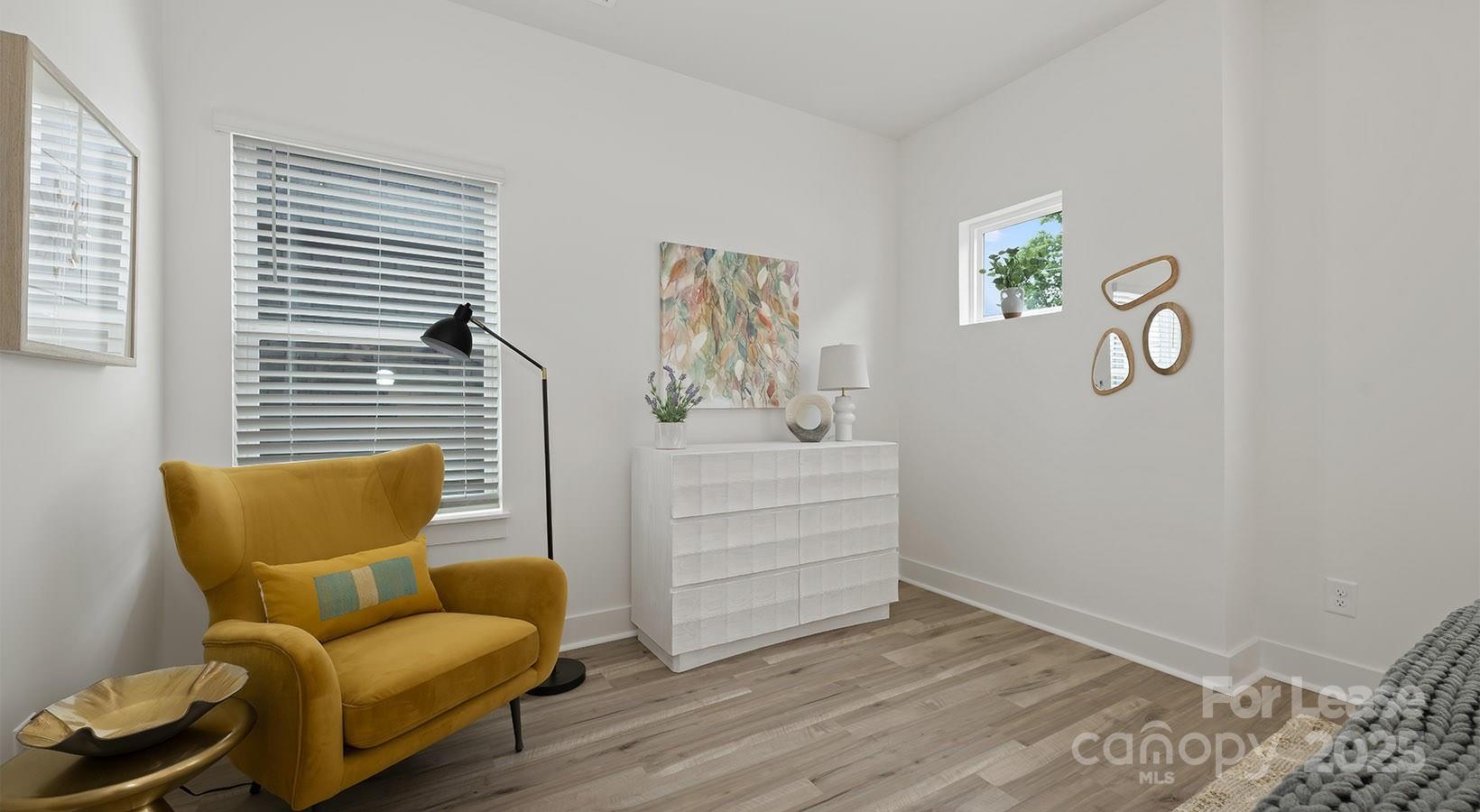 5150 Old Ridge Road, Unit B2 Charlotte, NC 28269 - Photo 22 of 27 a room with furniture and wooden floor