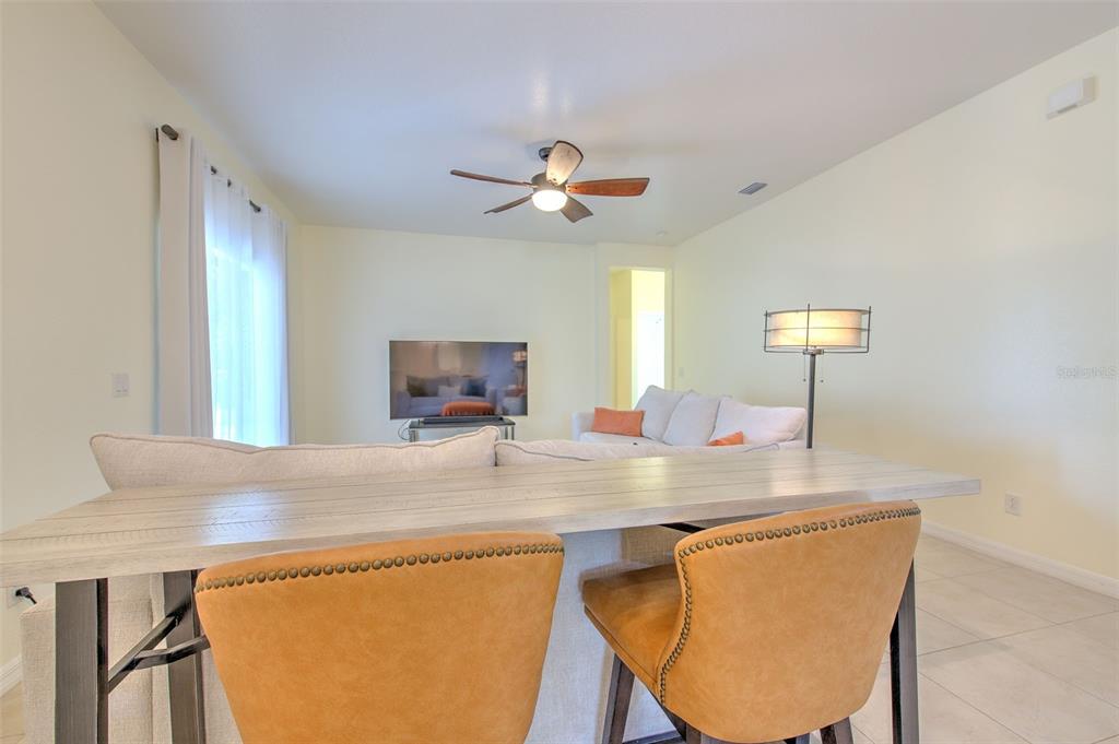 5409 Conch Shell Place Apollo Beach, FL 33572 - Photo 19 of 51 a view of kitchen island a sink wooden floor and a living room view
