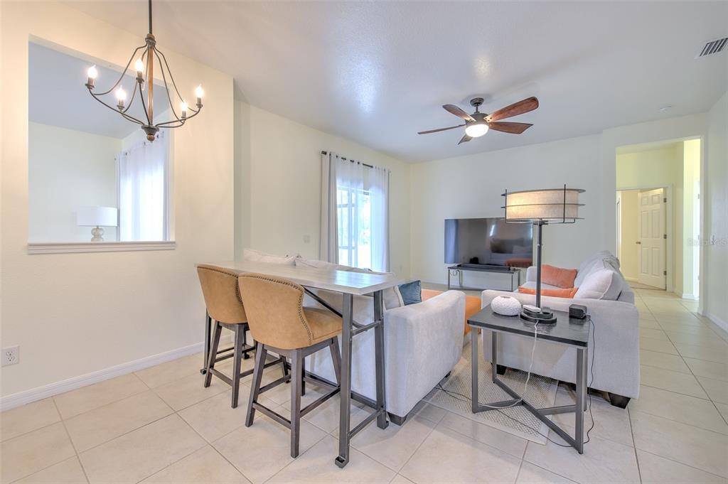 5409 Conch Shell Place Apollo Beach, FL 33572 - Photo 20 of 51 a dining room with furniture and window