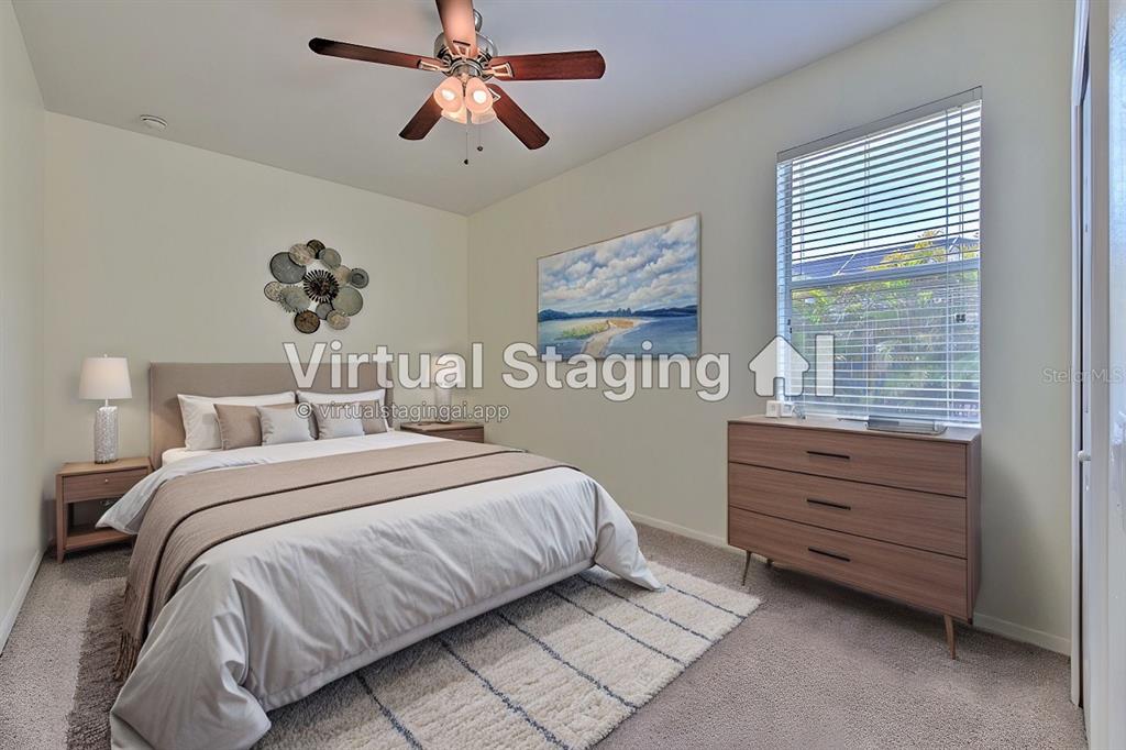 5409 Conch Shell Place Apollo Beach, FL 33572 - Photo 27 of 51 a bedroom with a bed and a window