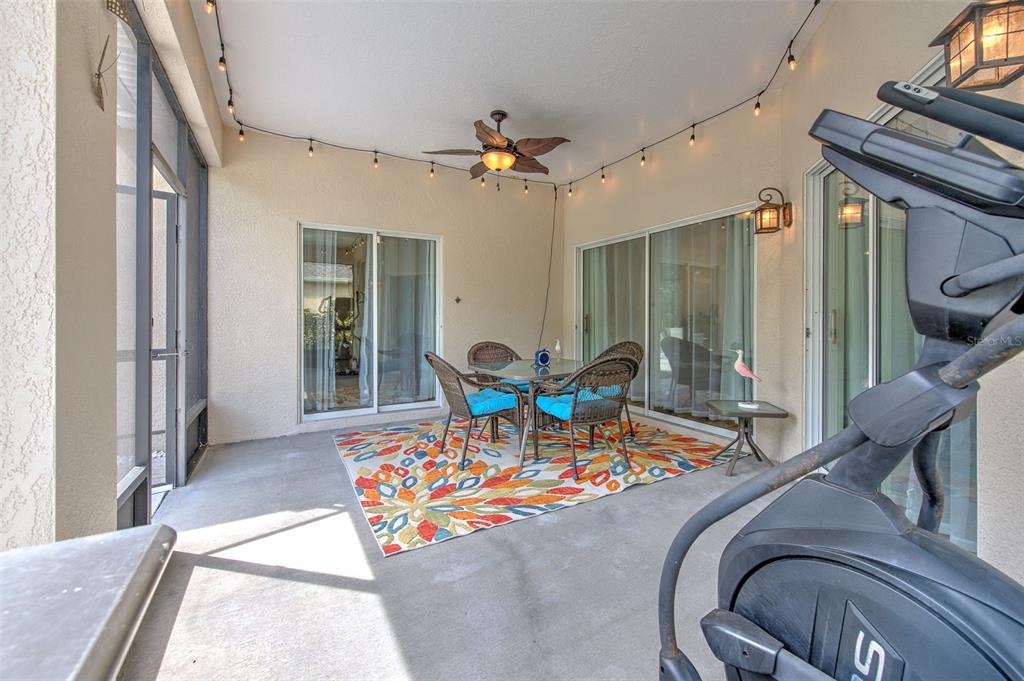5409 Conch Shell Place Apollo Beach, FL 33572 - Photo 33 of 51 a living room with furniture and a chandelier